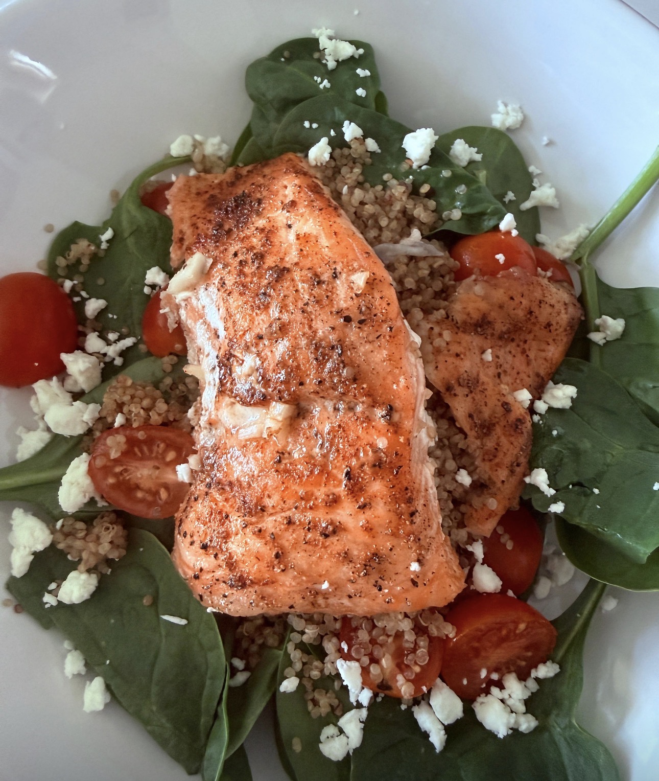Baked salmon with quinoa, spinach and feta
