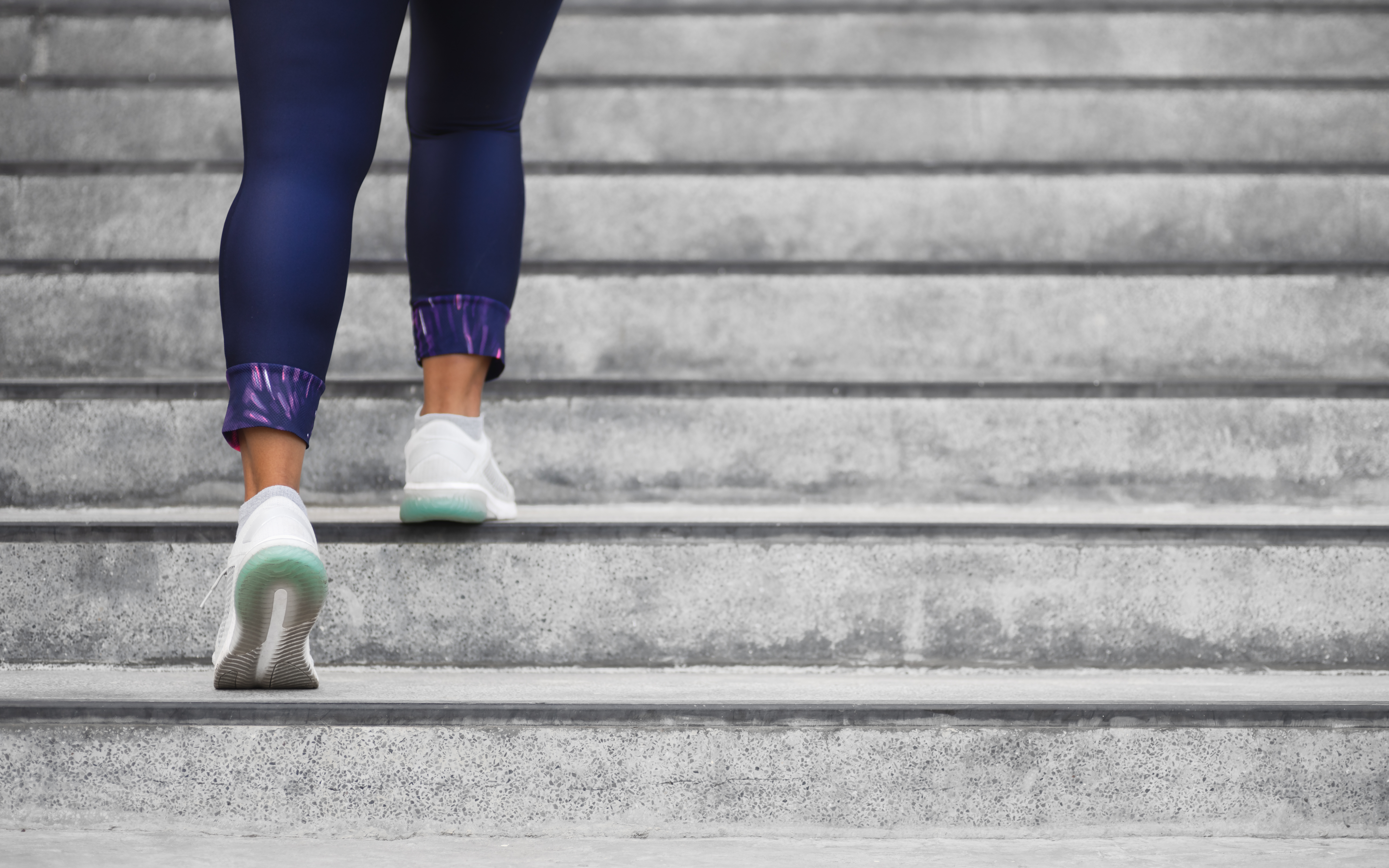 Woman climbing stairs during a workout